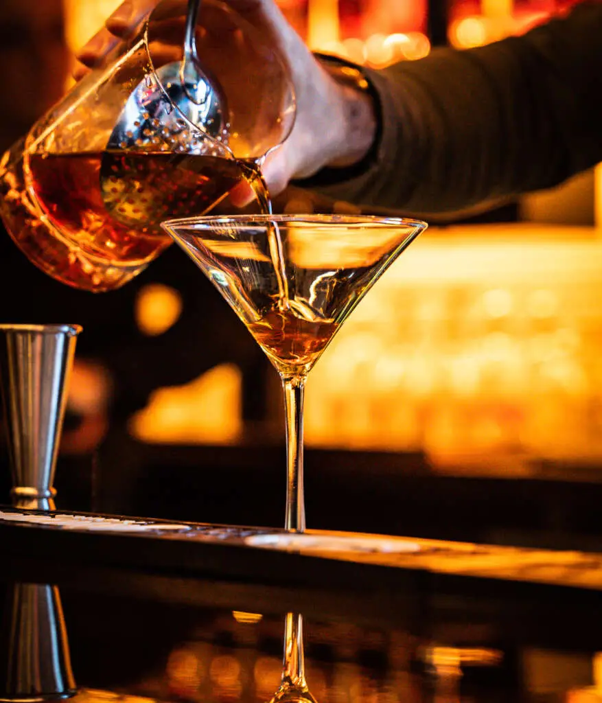 Echo Craft Kitchen Bartender making a cocktail in Watertown